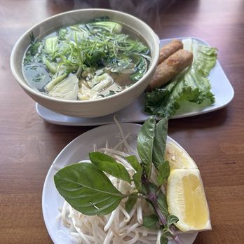 District 9 Kitchen - Vegetarian Tofu Pho with vegetables and egg rolls - Noodles Near Me - Anaheim, California District 9 Kitchen - Vegetarian Tofu Pho with vegetables and egg rolls - Noodles Near Me - Anaheim, California