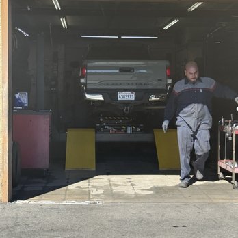 Lopez & Sons Tires - Truck on alignment machine. Plus the technician. - Tires Near Me - North Hills, California