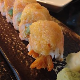 Paradise Island roll. Big. Shrimp tempura surrounded by crab salad and avocado, soy paper, spicy salmon on top. Paradise Island roll. Big. Shrimp tempura surrounded by crab salad and avocado, soy paper, spicy salmon on top.
