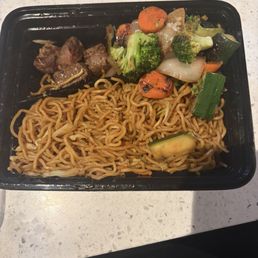 Left overs of the Steak Yakisoba Noodles plate with additional of Side of Vegetables