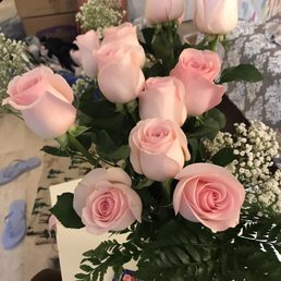 A dozen light pink roses with baby's breath. Stunning!