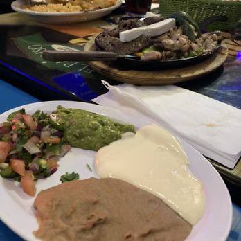 El Paraiso - Beans, crema, picante and guac! Background: fajita plate! - Mexican Near Me - Lakeside, Colorado