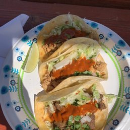 Beef, chicken, & pork tacos with red sauce. Beef, chicken, & pork tacos with red sauce.