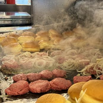 White Manna - White Manna's burger grill showing how they spectacularly slather on those onions - Burgers Near Me - Hackensack, New Jersey White Manna - White Manna's burger grill showing how they spectacularly slather on those onions - Burgers Near Me - Hackensack, New Jersey