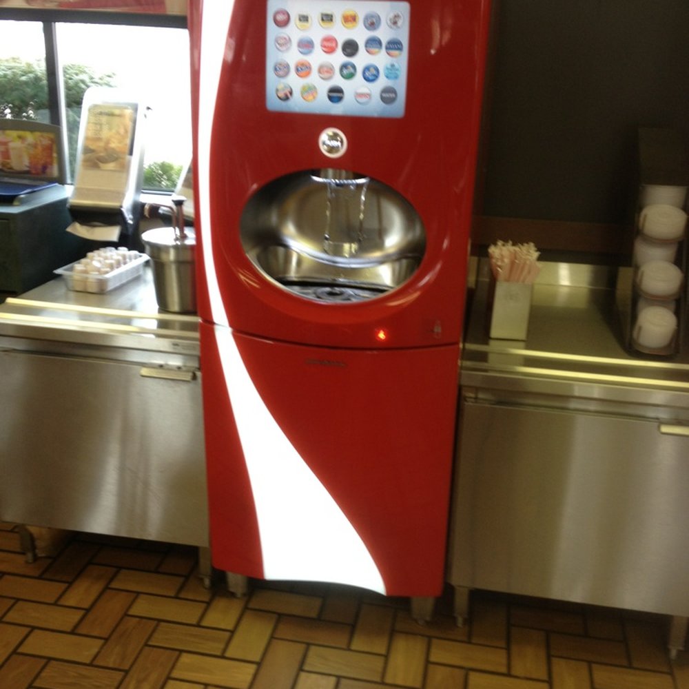a coca cola machine in a restaurant a coca cola machine in a restaurant