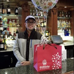 my boyfriend and his gift! I surprised him at the restaurant he worked at
