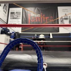 Janjira Gym - Photo from the front of boxing ring looking up at back wall