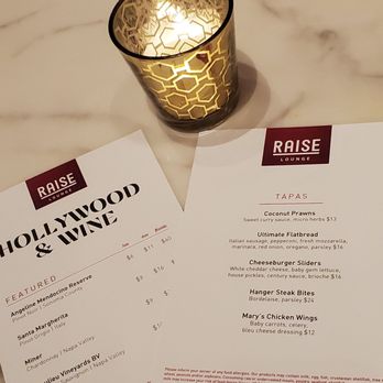 Raise Lounge - the menu and candle on the table - Lounges Near Me - Inglewood, California Raise Lounge - the menu and candle on the table - Lounges Near Me - Inglewood, California