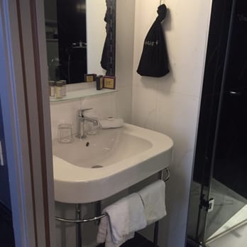 Les Plumes - Cozy sink area with a hairdryer - Hotels Near Me - Paris, 75 Les Plumes - Cozy sink area with a hairdryer - Hotels Near Me - Paris, 75