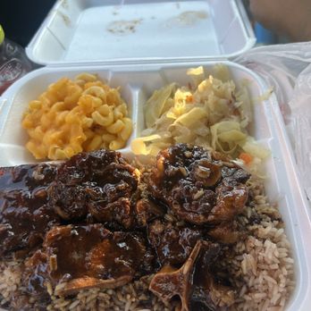 Jamacian Jerk - Oxtail Plate on a bed of rice, with Macaroni and cheese, and cabbage - Caribbean Near Me - Perry, Georgia