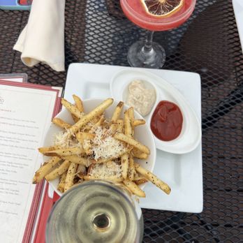 Starlight Lounge - Truffle fries + white wine + raspberry lemon drop - Lounges Near Me - Carmel-by-the-Sea, California