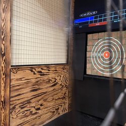 Crave Hot Dogs & BBQ - Fayetteville - Axe throwing, strange thing to take up space with!