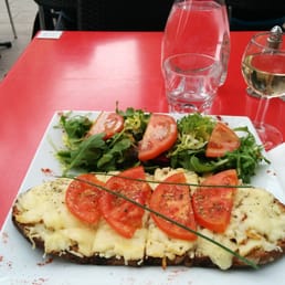 Slice of bread with chicken, cheese and tomatoes. Slice of bread with chicken, cheese and tomatoes.