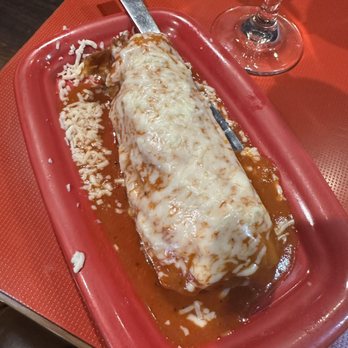 Mesquite Grill - a red plate with a burrito - Mexican Near Me - Rochester, New York Mesquite Grill - a red plate with a burrito - Mexican Near Me - Rochester, New York