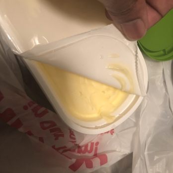 Schnucks South City - a person pouring cheese into a container - Grocery Near Me - St. Louis, Missouri Schnucks South City - a person pouring cheese into a container - Grocery Near Me - St. Louis, Missouri