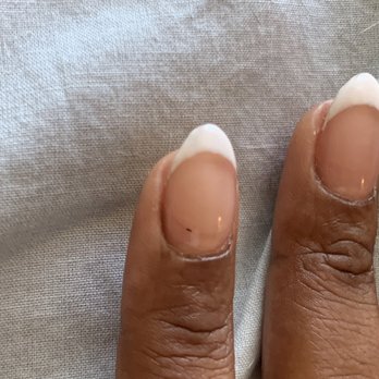 Get Nails - Black dot underneath that could have been filed down before putting acrylic on for the fill - Nail Salons Near Me - Culver City, California