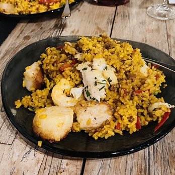 Bolero Restaurante - Front : Seafood paella   Back: meat paella - Tapas/Small Plates Near Me - Temecula, California