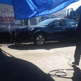 Getting my flat tire patched up. Getting my flat tire patched up.