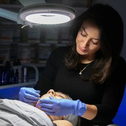 DermaGlow MedSpa - Treatment room, facial in progress