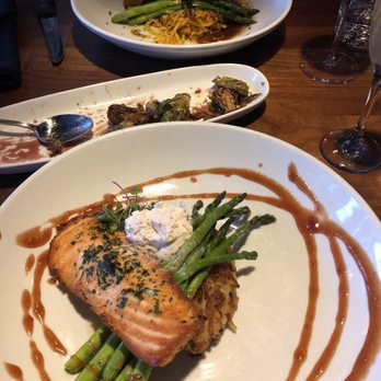 Hubbard Grille - From front to back: Salmon, Crispy Brussels Sprouts, Pan Roasted Pork Chop - New American Near Me - Columbus, Ohio Hubbard Grille - From front to back: Salmon, Crispy Brussels Sprouts, Pan Roasted Pork Chop - New American Near Me - Columbus, Ohio