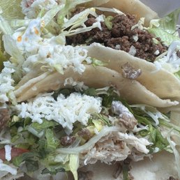 "Shredded beef" mush (likely ground beef) on top. Flavorless chicken taco on bottom. "Shredded beef" mush (likely ground beef) on top. Flavorless chicken taco on bottom.