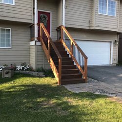 Elevate Construction - Finished front entry staircase.