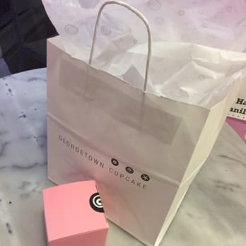 Georgetown Cupcake - Gift bag with one cupcake inside and the "gift wrap" is just a ribbon placed on the box. - Cupcakes Near Me - Washington, DC, District of Columbia Georgetown Cupcake - Gift bag with one cupcake inside and the "gift wrap" is just a ribbon placed on the box. - Cupcakes Near Me - Washington, DC, District of Columbia