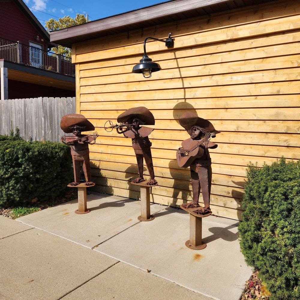 Western Tap - a row of old fashioned western style pipes on a sidewalk in front of a house - Bars Near Me - Bloomington, Illinois Western Tap - a row of old fashioned western style pipes on a sidewalk in front of a house - Bars Near Me - Bloomington, Illinois
