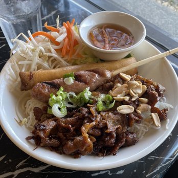 Taste of Pho - a plate of food on a table - Vietnamese Near Me - Surrey, British Columbia Taste of Pho - a plate of food on a table - Vietnamese Near Me - Surrey, British Columbia