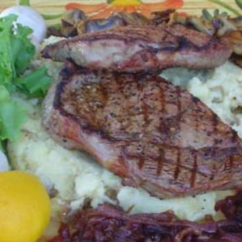 The Pit Stop BBQ - Seared Rib-eye on Roasted Garlic Mashed Potatoes with Caramelized Onions and Lemon Thyme Mushrooms - Caterers Near Me The Pit Stop BBQ - Seared Rib-eye on Roasted Garlic Mashed Potatoes with Caramelized Onions and Lemon Thyme Mushrooms - Caterers Near Me