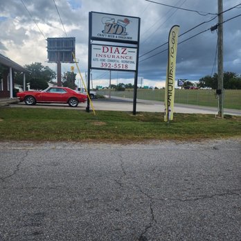 JD’s Craft Beer & Daiquiris - a red car parked in front of a sign - Beer Bar Near Me - D'Iberville, Mississippi JD’s Craft Beer & Daiquiris - a red car parked in front of a sign - Beer Bar Near Me - D'Iberville, Mississippi