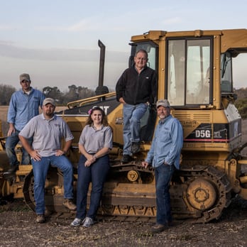 Duckworth Construction - a group of men standing in front of a bulldozer - General Contractors Near Me Duckworth Construction - a group of men standing in front of a bulldozer - General Contractors Near Me