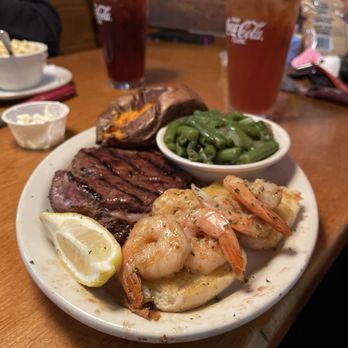 Texas Roadhouse - 12 ounce ribeye and shrimp with green beans and baked sweet potato. - Steakhouses Near Me - Fresno, California