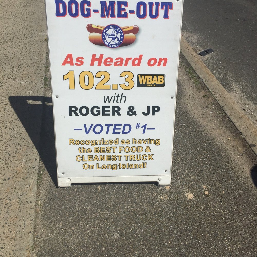 Dog Me Out - a sign on the side of the road - Hot Dogs Near Me - Patchogue, New York