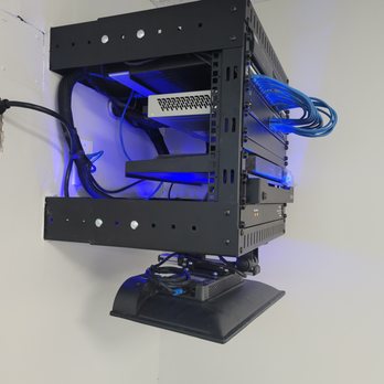 Sierra Network & Cable - Ethernet and Security camera system in a wall rack with cable protector - Home Network Installation Near Me Sierra Network & Cable - Ethernet and Security camera system in a wall rack with cable protector - Home Network Installation Near Me