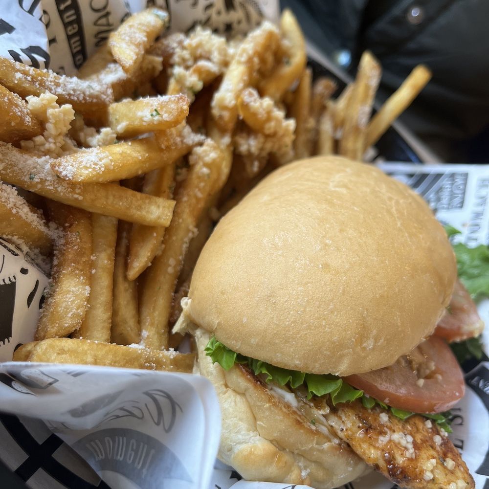 Cajun Chicken Sandwich with Garlic Fries. Cajun Chicken Sandwich with Garlic Fries.