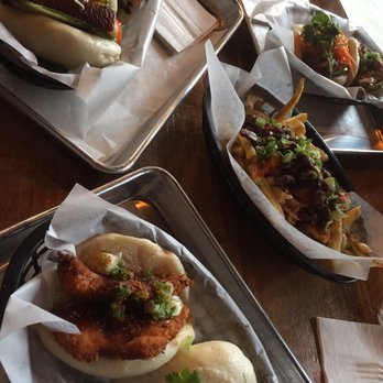 Bao Sandwich Bar - In this photo I got katsu chicken on left and five spice pork belly on right. My family split the kimchi fries in the middle. - Vietnamese Near Me - Waterloo, Ontario Bao Sandwich Bar - In this photo I got katsu chicken on left and five spice pork belly on right. My family split the kimchi fries in the middle. - Vietnamese Near Me - Waterloo, Ontario