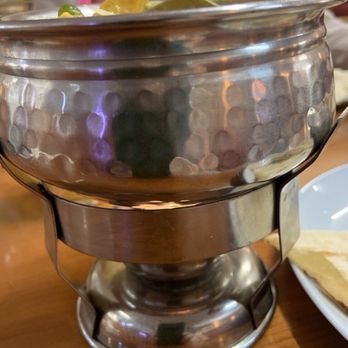 Buddha - Vegetable Korma in a dish kept warm by a candle. - Indian Near Me - Brno, JM