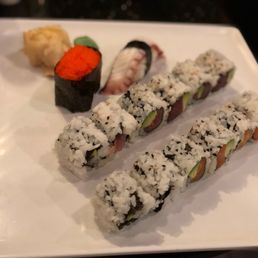 a variety of sushi on a white plate a variety of sushi on a white plate