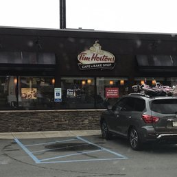a car parked in front of a restaurant