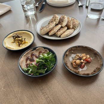 The Aperture - Samples of Eggplant & Black Garlic, Hummus & Tehina and Chicken Liver Mouse along with homemade pita. - Greek Near Me - Cincinnati, Ohio The Aperture - Samples of Eggplant & Black Garlic, Hummus & Tehina and Chicken Liver Mouse along with homemade pita. - Greek Near Me - Cincinnati, Ohio