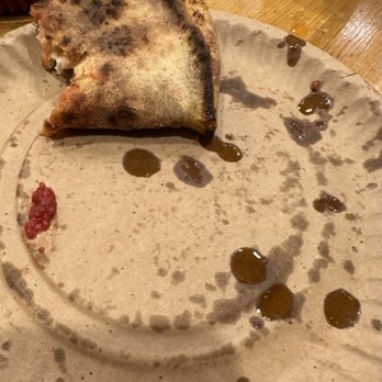 Audrey Jane's Pizza Garage - The fold and the oil makes this an authentic slice! - Pizza Near Me - Boulder, Colorado