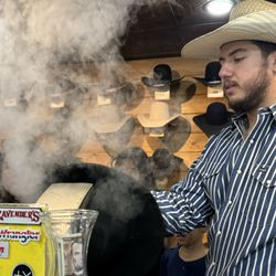 Cavender's Boot City - Jacob showing the kids the process of steaming a hat