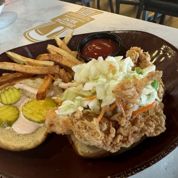 Cat Cora's Taproom - Chicken sandwich with fries - Wine Bars Near Me - Detroit, Michigan