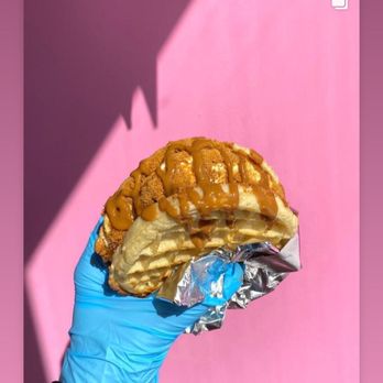 The Custard Parlor - a hand holding a pastry - Ice Cream & Frozen Yogurt Near Me - Livonia, Michigan The Custard Parlor - a hand holding a pastry - Ice Cream & Frozen Yogurt Near Me - Livonia, Michigan