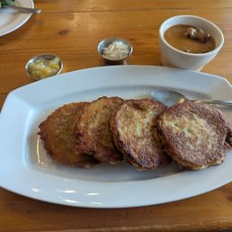 Potato pancakes, goulash on the side along with sour cream and some spiced apples.