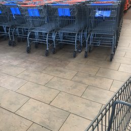 rows of shopping carts in a store rows of shopping carts in a store