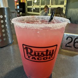 Strawberry iced margarita with sugar rim
