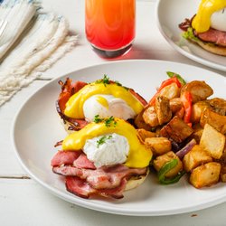 The Benediction by Toast - A classic never goes out of style - a split english muffin topped with hickory smoked shoulder bacon, poached eggs and hollandaise sauce.