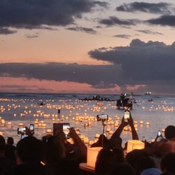 Shinnyo Lantern Floating - Outside at night where you can see the lit up lanterns